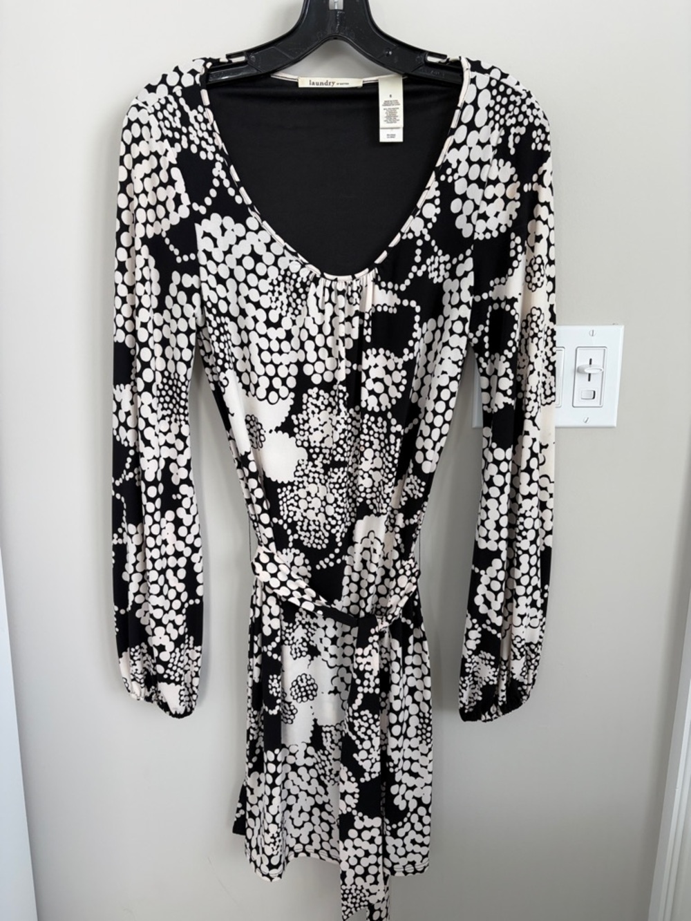 Great comfy travel dress.  Belted.  Scoop neckline.  Polyester